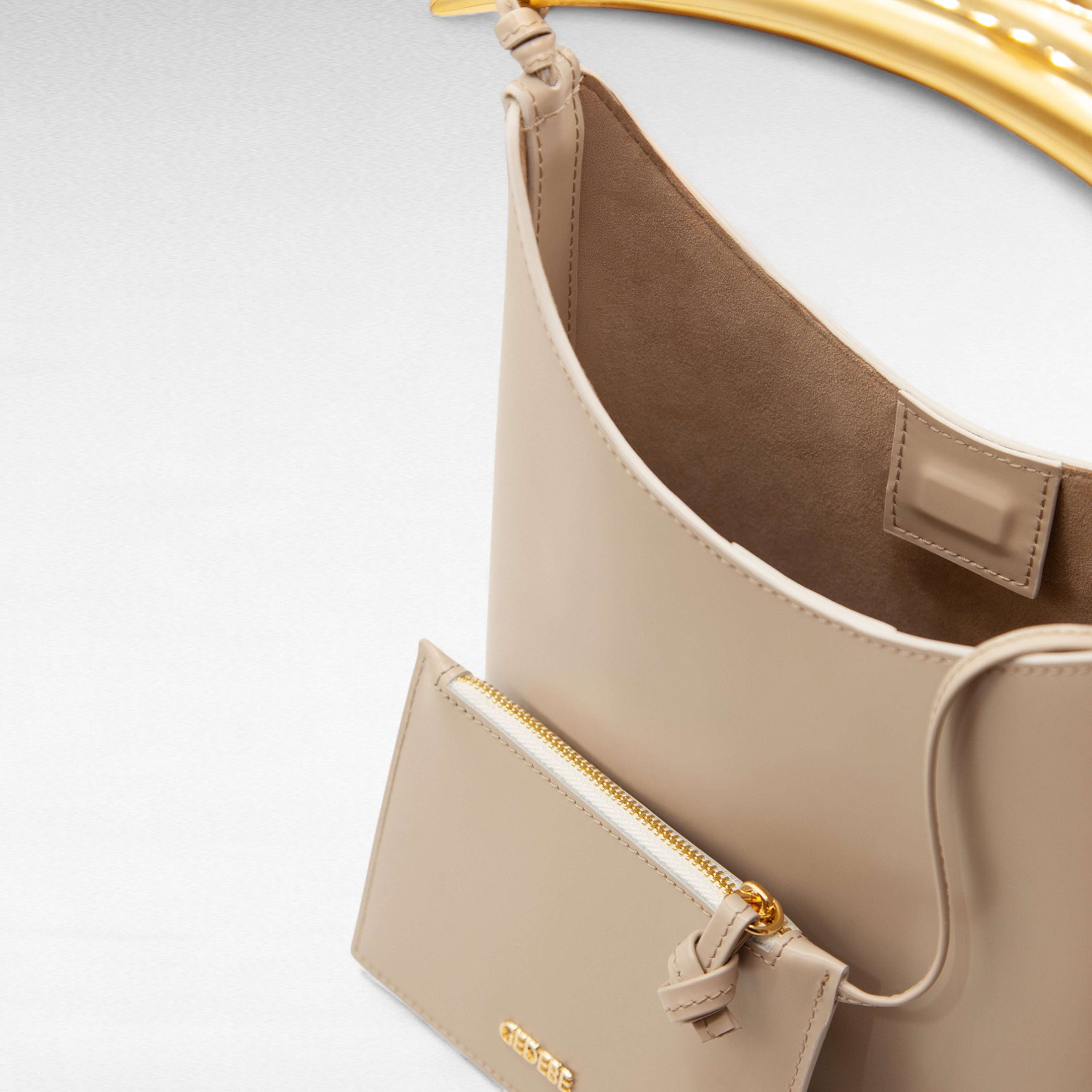 beige leather handbag gold handle
