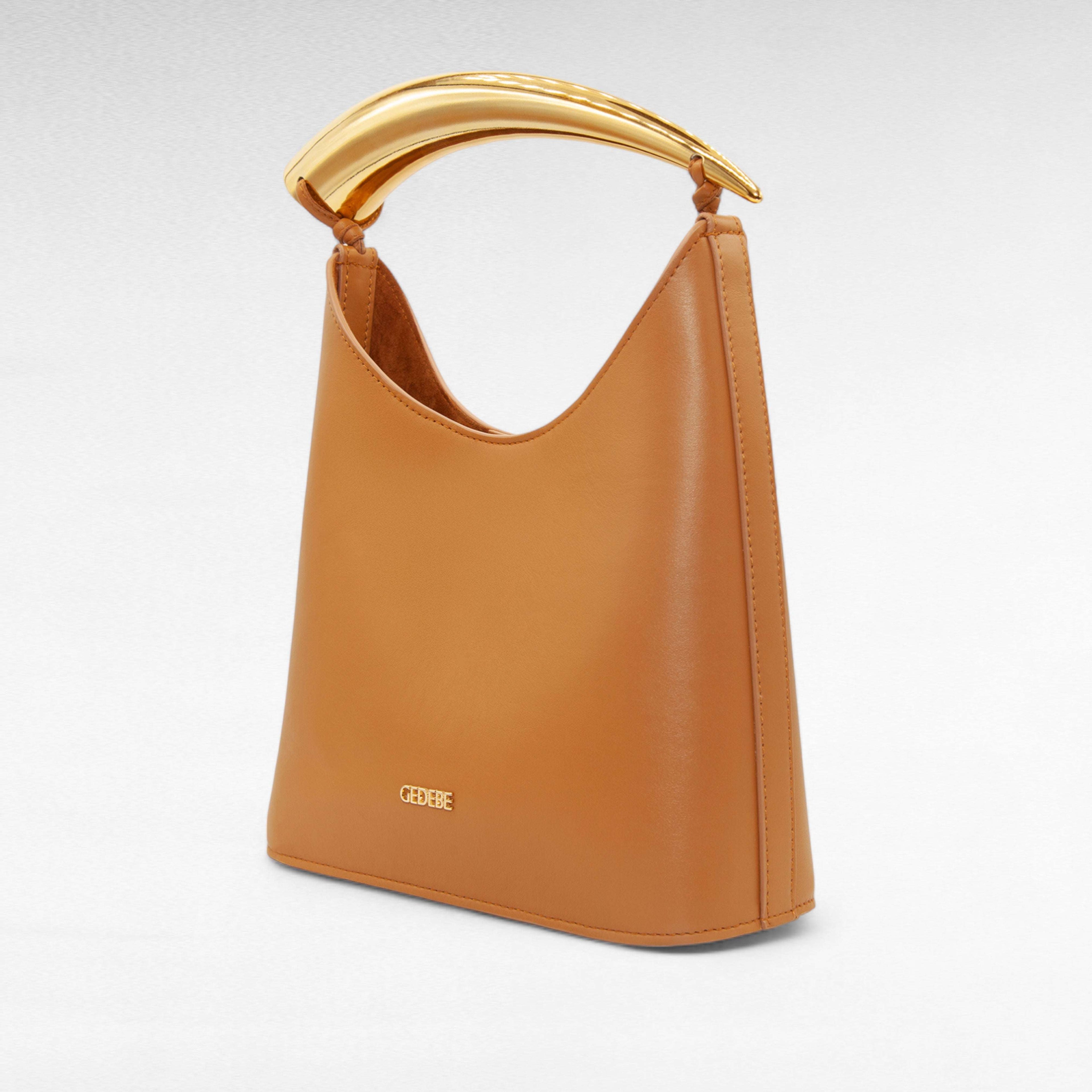 Caramel camel leather handbag with gold handle and inside zip pouch