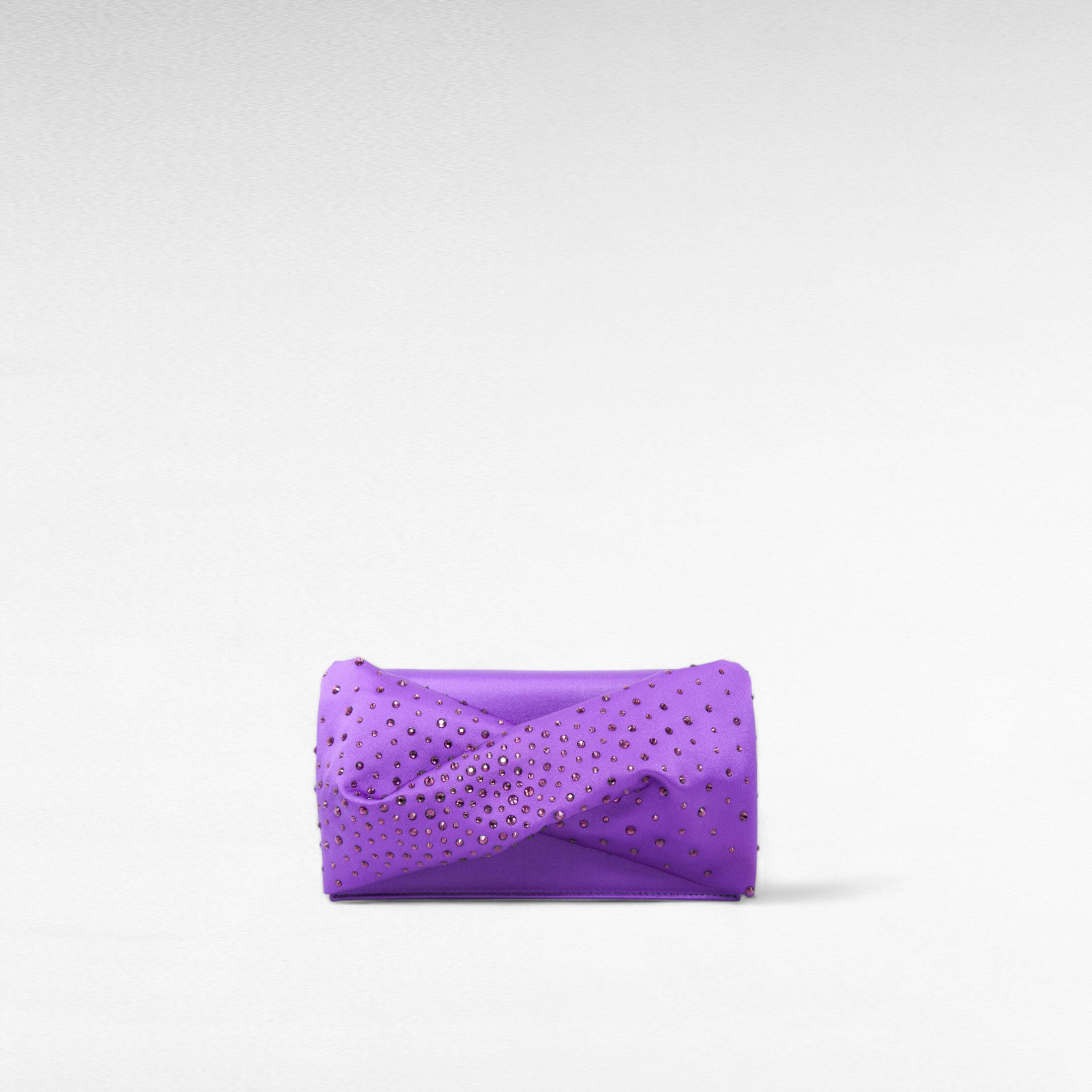 Blue hand-held clutch bag with crystal and front bow twist