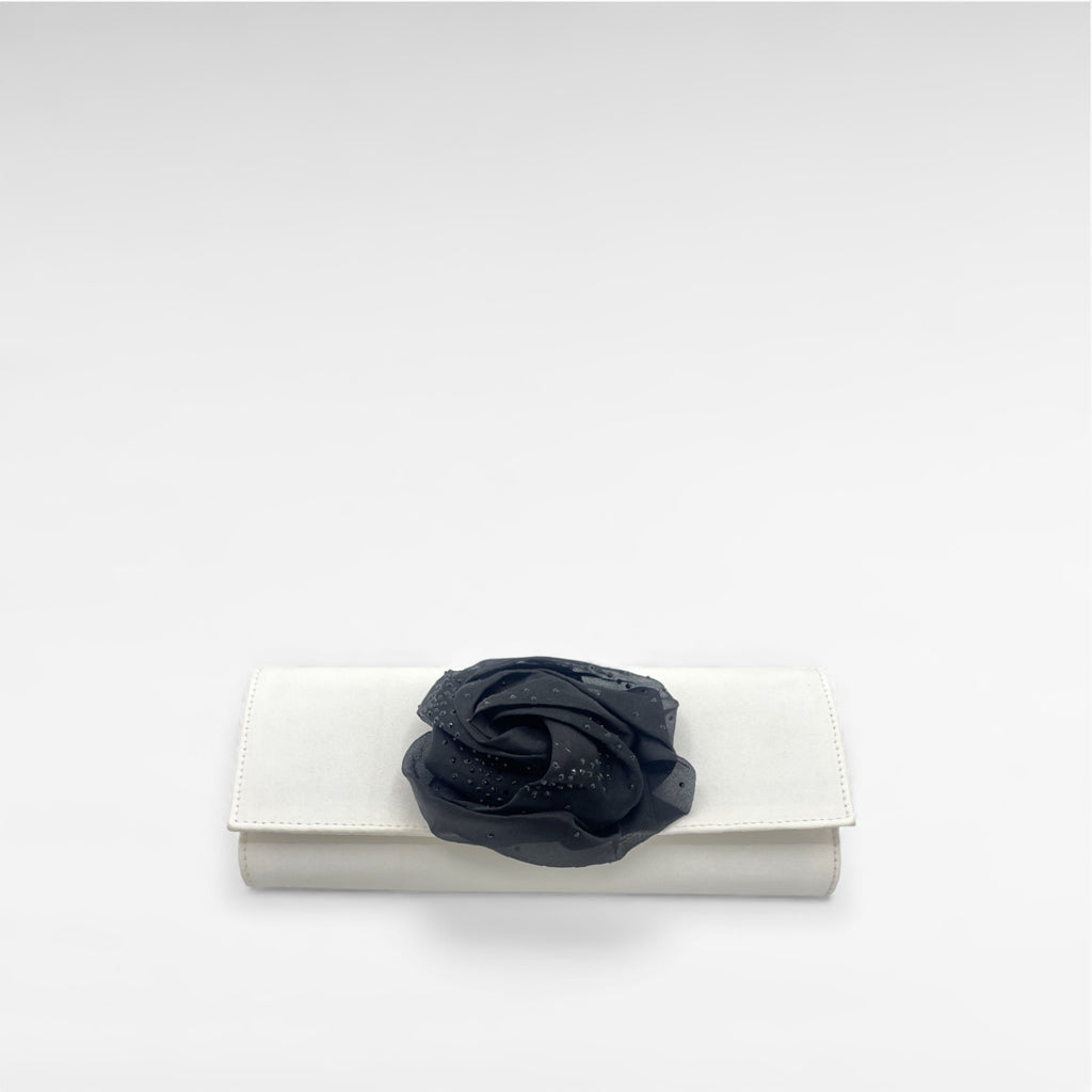 white satin clutch with black flower