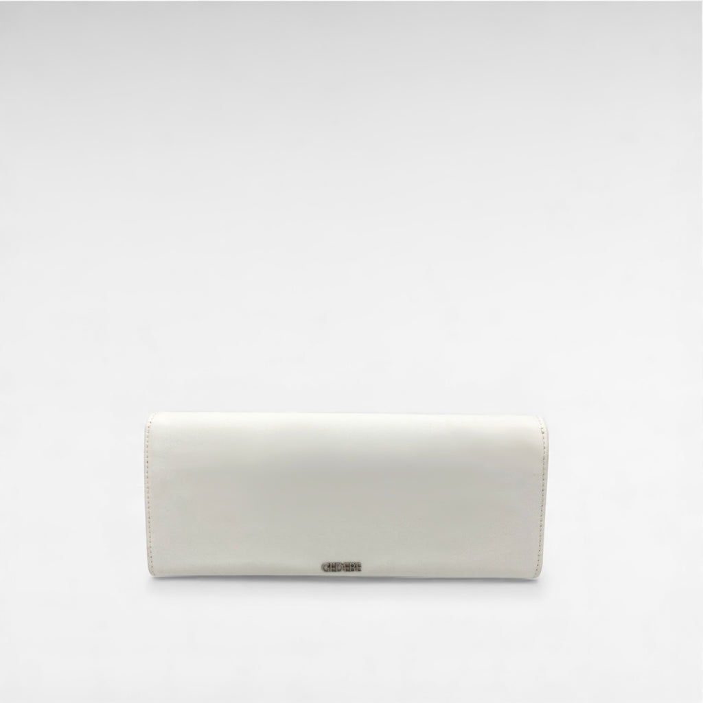 white satin clutch with flower