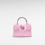 Pink mini leather handbag with flower and top handle